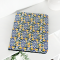 Coconut Lane notebook with lemon and blue floral cover next to matching Amalfi Lemon iPad case.