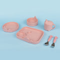 The Nuby Animal Friends 6-Piece Dinnerware Set - Pink Whale features a sectioned plate, two bowls, sippy cup, spoon, and fork with animal designs on a blue background—perfect for encouraging self-feeding.