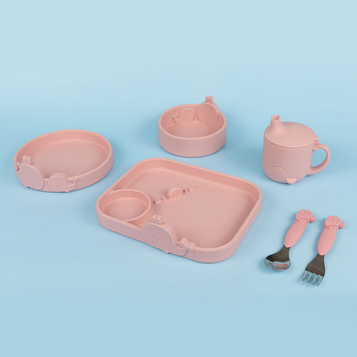 The Nuby Animal Friends 6-Piece Dinnerware Set - Pink Whale features a sectioned plate, two bowls, sippy cup, spoon, and fork with animal designs on a blue background—perfect for encouraging self-feeding.