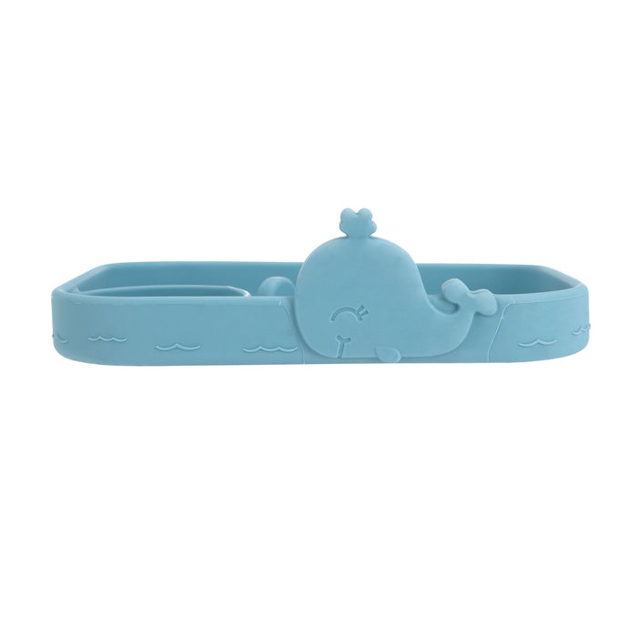 The Animal Friends All Silicone Tray is a blue whale-shaped silicone food tray with embossed wave patterns and a smiling whale, ideal as a baby plate for self-feeding or holding snacks and small items.