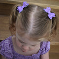 Annabelle - small purple glitter piggytail bows