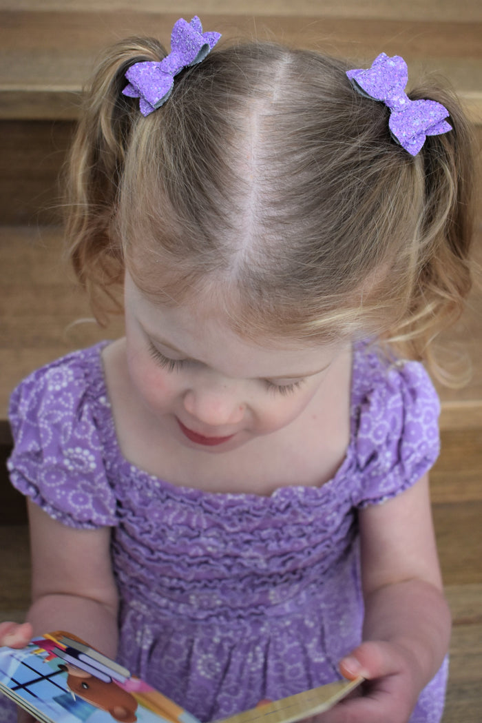 Annabelle - small purple glitter piggytail bows