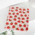 Strawberry-patterned iPad case with floral accents in pink and red, featuring a smooth finish by Coconut Lane.