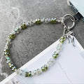 Bow & Bling Fancy Phone Charm â Bow & Bling Phone Charm - Iridescent & Emerald Beaded Phone Wrist Strap Put a bow on it and make it sparkle!