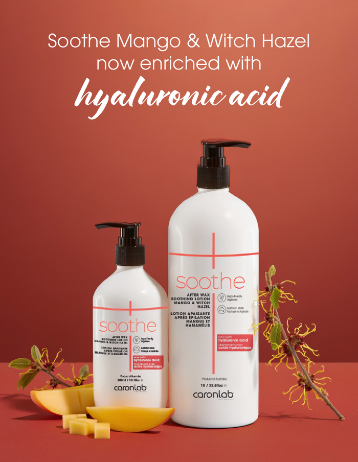 Two bottles of Caronlab Soothe Mango & Witch Hazel lotion on a red background with text about hyaluronic acid.