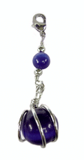 silver charm with blue round bead and metal wire setting