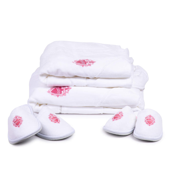 2 Eloise adult robes next to 2 pairs of Eloise slippers on a white background