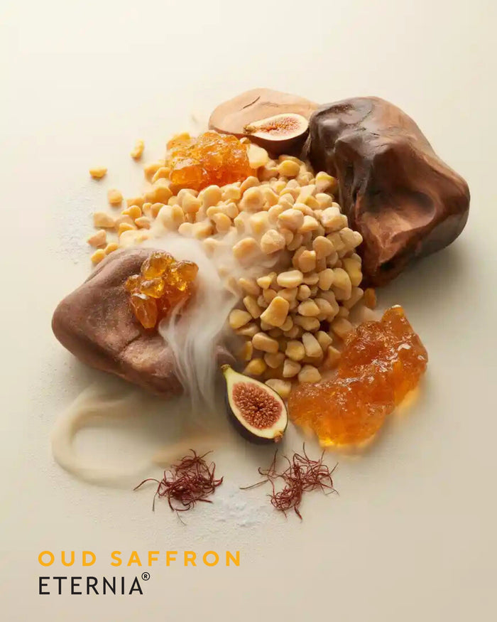 Oud and saffron perfume mist ingredients: saffron strands, resin chunks, and oud wood