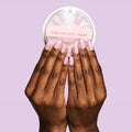 Fierce & Loving - Press-On | Medium | Oval showing hands with medium oval false nails in bold lilac shade
