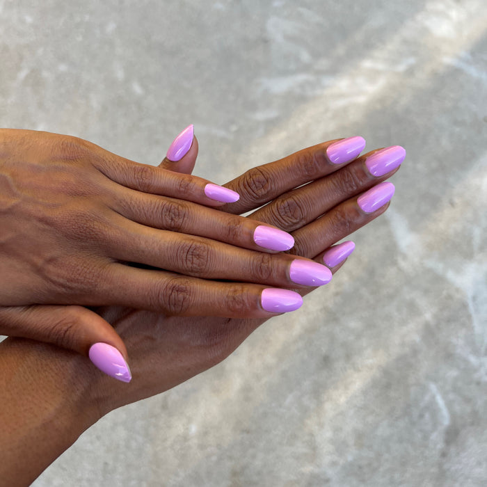 Fierce & Loving - Press-On | Medium | Oval hands crossed displaying medium oval press-on nails in fresh lilac polish