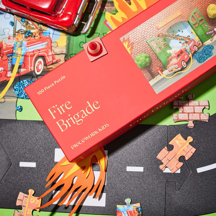 Fire Brigade puzzle set with pieces and box on a colorful base