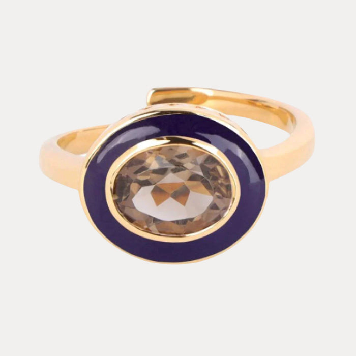 a gold ring with a stone in the middle