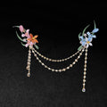 Chanhua handmade dual flower brooch set in warm and cool color options, connected by a draped pearl and crystal chain, displayed on a dark background