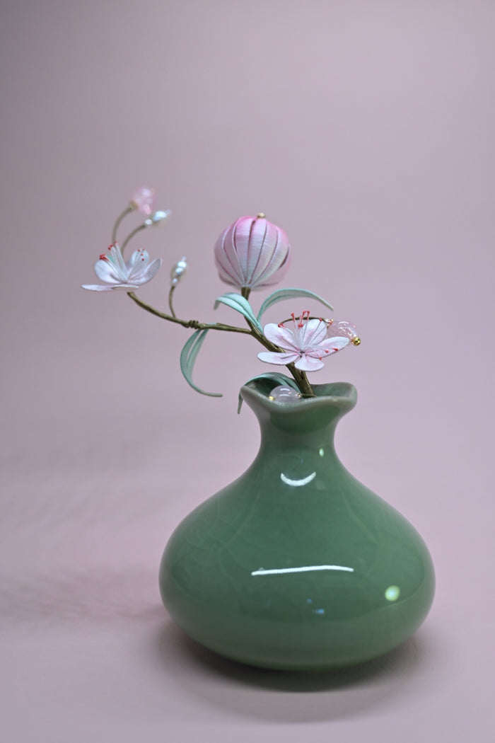 Handmade Chanhua peach blossom hairpins set with pink flowers and leaves on a light background-3