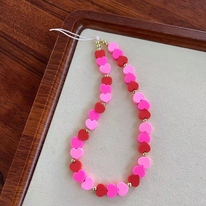 Heartbreaker Fancy Phone Charm â Heartbreaker Phone Charm - Pink & Red Heart Beaded Phone Wrist Strap Break hearts, not phones!
