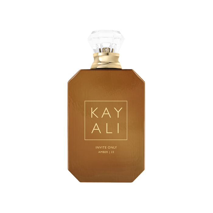 Brown perfume bottle with gold cap on a white background
