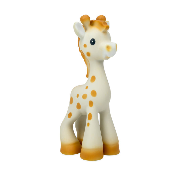Jackie the Giraffe Natural Rubber Teether features orange spots, big black eyes, and a friendly face. Made from all-natural rubber to support sensory development, it stands upright against a plain white background.