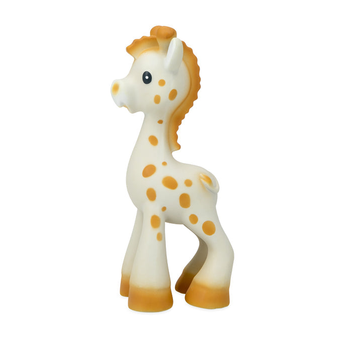 Jackie the Giraffe Natural Rubber Teether, a small white giraffe with orange spots, mane, and hooves, stands upright facing left on a plain white background—ideal for sensory development.