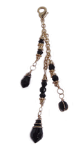 gold multi-strand chain hair charm with black faceted beads and dangle accents front view
