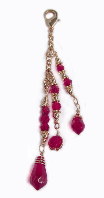 Large gold 3-strand hair charm with red beads and lobster clasp