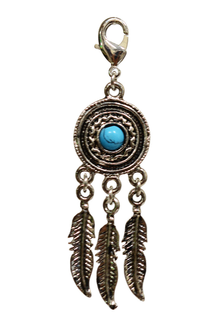 silver dream catcher charm with turquoise center stone and hanging feather details and lobster clasp