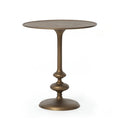 Brass finished pedestal table on a white background. | Wildwood Home Co.