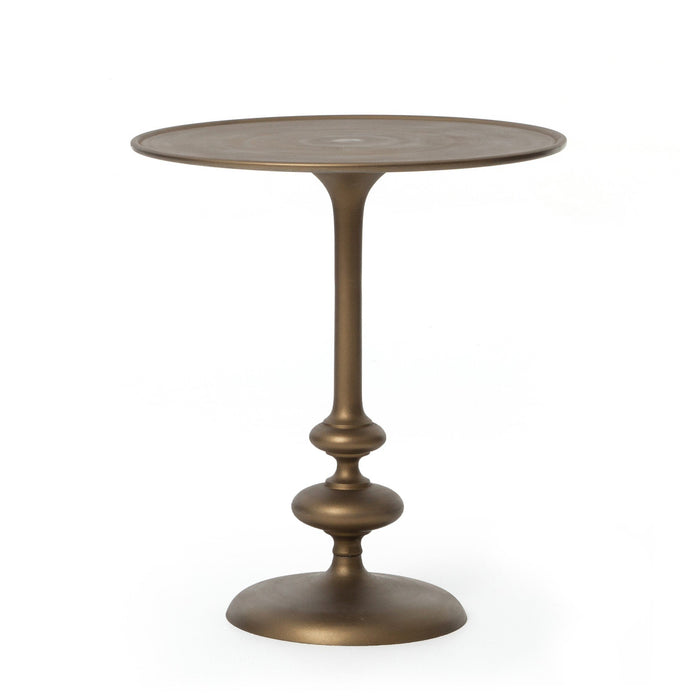 Brass finished pedestal table on a white background. | Wildwood Home Co.