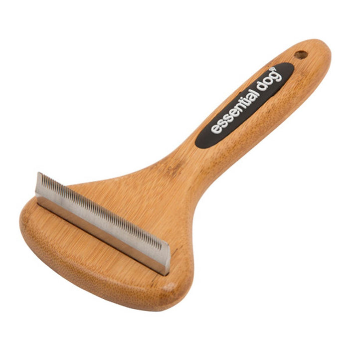 Wooden pet grooming brush with metal edge on a white background, branded 'essential dog'.