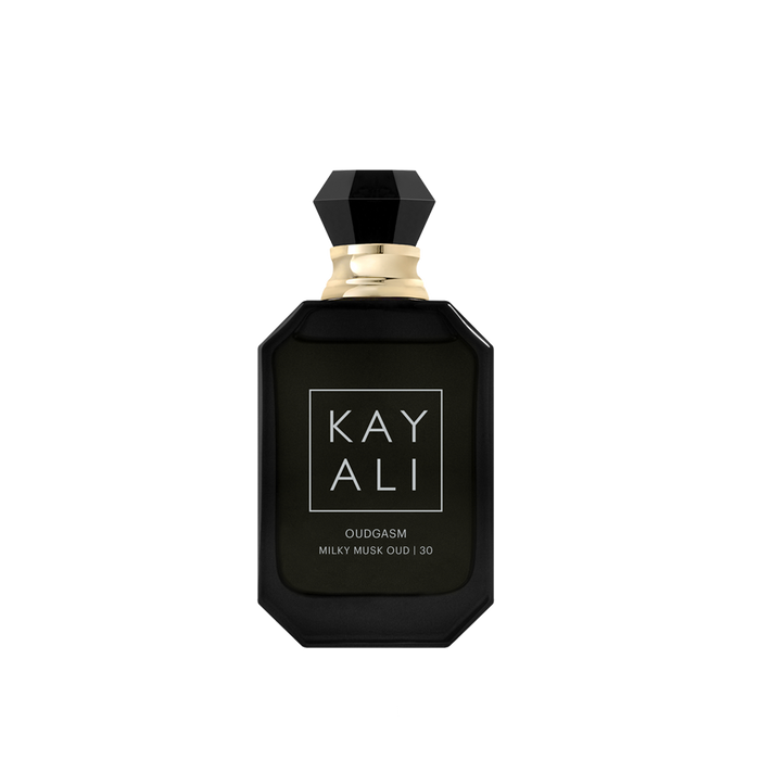 Black perfume bottle with gold cap on a white background
