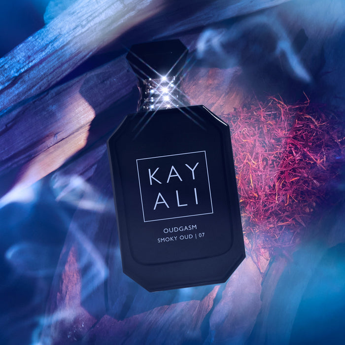 Black perfume bottle labeled 'KAYALI' with a mystical background