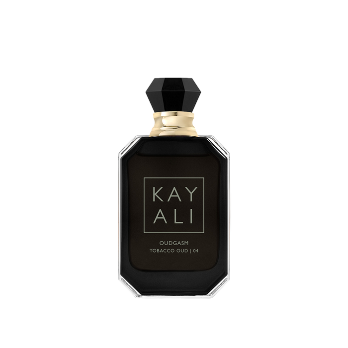 Black perfume bottle with gold cap on a white background