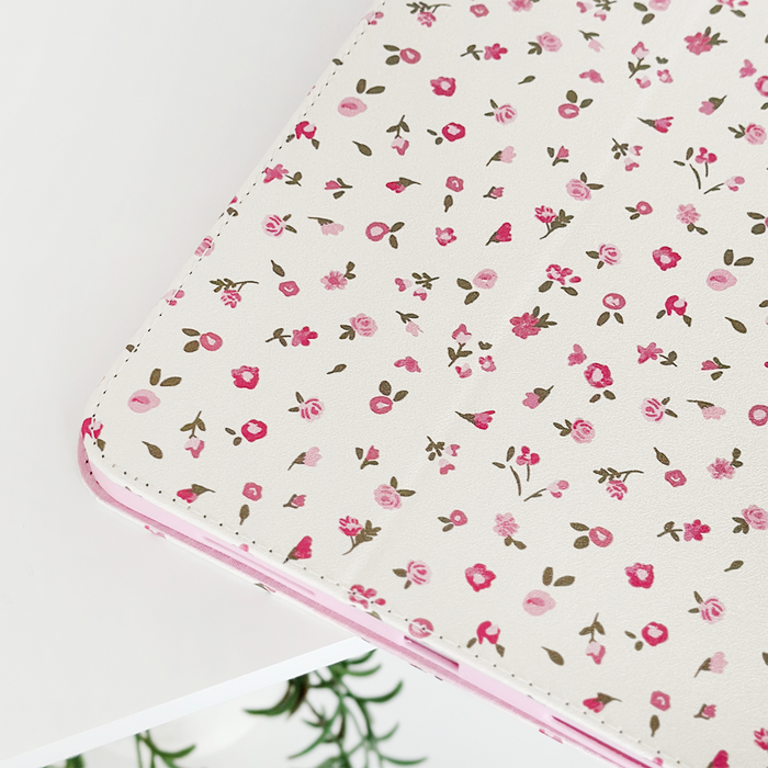 Coconut Lane iPad case with pink watercolor floral pattern on a white background.