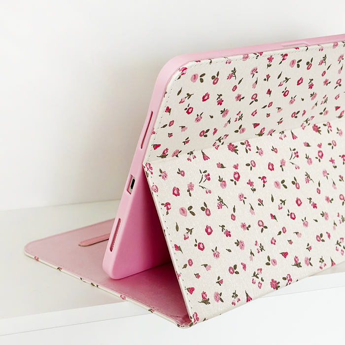 White iPad case with pink watercolor floral pattern by Coconut Lane.