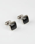 Silver cufflinks with black glossy square cushion fronts, hinged back design