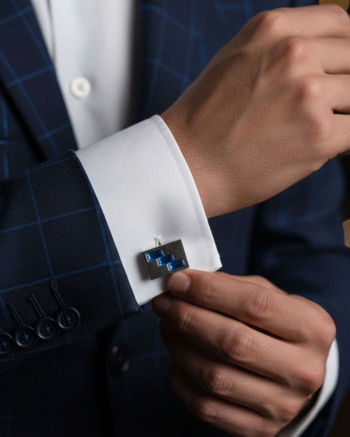Men's square cufflinks with blue geometric crystal inlay on a white shirt cuff