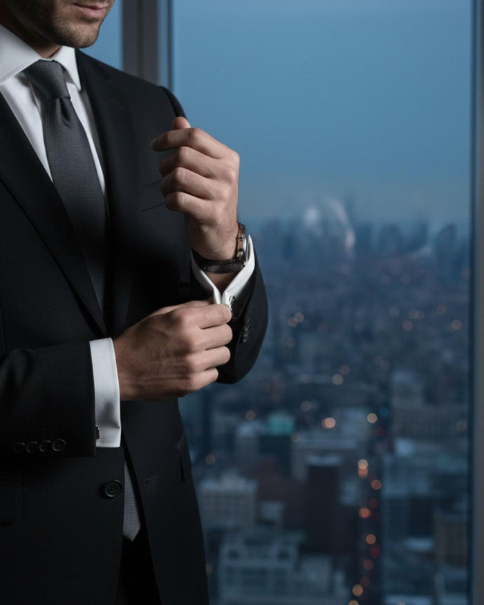 Cufflinks being fastened on a dress shirt cuff