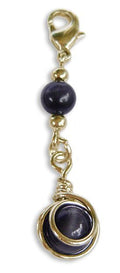 Black bead hair charm with gold metal wrap and clasp for braids and Hair Twisters on white background