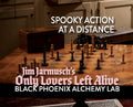 Wooden chessboard with black pieces on a wooden floor, text overlay about 'Only Lovers Left Alive' and 'Black Phoenix Alchemy Lab'.