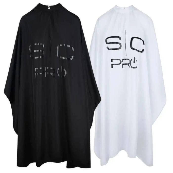 Black and white barber aprons with 'SC Pro' logo on a white background